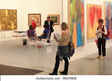 MILAN - APRIL 08: People look at paintings and sculpture galleries during MiArt, international exhibition of modern and contemporary art on April 08, 2011 in Milan, Italy