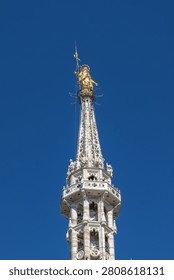 Milan cathedral rooftop features the largest walkable Gothic roof in the world and the iconic gold Madonnina statue