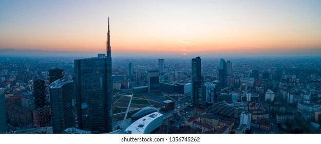 Milan City Skyline At Dawn, Aerial View, Flying Over Financial Area Skyscrapers In Porta Nuova District.