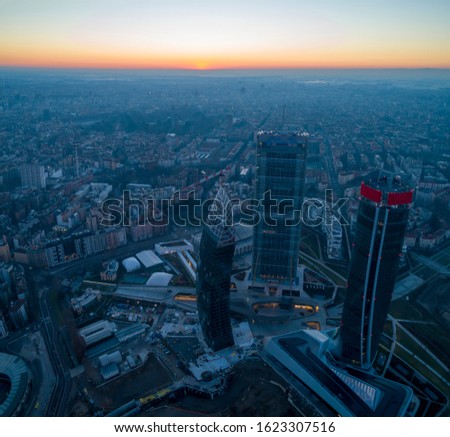Milan city skyline at sunrise, aerial view. Panoramic view of new skyscrapers in Citylife district at dawn.