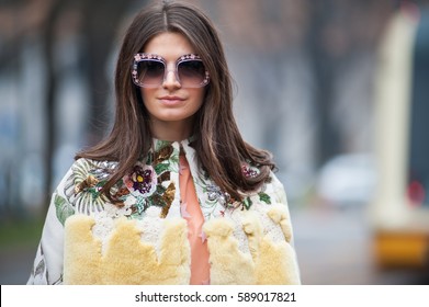 MILAN, FEBRUARY 23, 2017: woman poses for photographers before FENDI fashion show at Milan Woman Fashion Week street style Fall/Winter 2017/2018