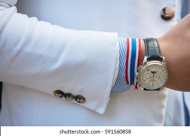 MILAN - FEBRUARY 25: Man With Patek Philippe Watch And Preppy Bracelet Before Ermanno Scervino Fashion Show, Milan Fashion Week Street Style On February 25, 2017 In Milan.