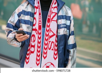 MILAN - FEBRUARY 27: Man With Blue And Silver Gucci Jacket And Football Club Scarf Before Giorgio Armani Fashion Show, Milan Fashion Week Street Style On February 27, 2017 In Milan.