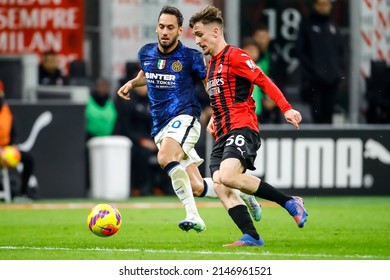 Milan, Italy. 01 March 2022. Italian Cup Football. AC Milan VS FC Inter 0-0. Alexis Saelemaekers, Milan, And Hakan Calhanoglu, Inter.