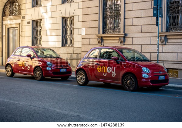 Milan, Italy 08.08.2019 Sharing economy of Milan
operated by the municipality of the city. Small red Fiat 500
vehicles called 