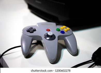 Milan, Milan / Italy - 10/07/2018: Grey Nintendo 64 Game Controller Isolated On White Background.