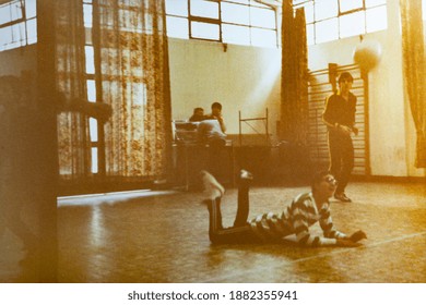 MILAN, ITALY 18 AUGUST 1975: Kids Play Volleyball In The School Gym