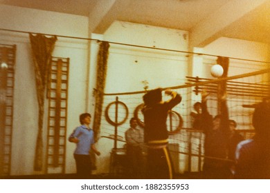 MILAN, ITALY 18 AUGUST 1975: Kids Play Volleyball In The School Gym