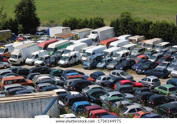 Milan,\
Italy - 18 July 2014: Old vehicles in a scrap\
yard