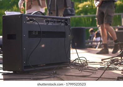 MILAN, ITALY 20 AUGUST 2020: Back Of A Guitar Amp On The Stage Of The Concert With Musicians Playing On The Background