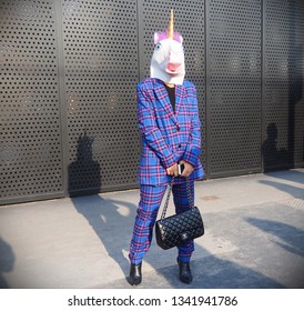 MILAN, Italy: 20 February 2019: Fashion Blogger Posing With Unicorn Mask Before Gucci Fashion Show During Milan Fashion Week Fall/winter 2019/2020