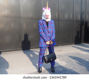 MILAN, Italy: 20 February 2019: Fashion Blogger Posing With Unicorn Mask Before Gucci Fashion Show During Milan Fashion Week Fall/winter 2019/2020