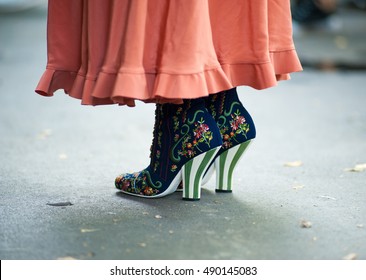 Milan, Italy, 21 September 2016 - Woman Poses In Skirt And Ankle Boots With Embroidery For Photographers Before FENDI Fashion Show At Milan Woman Fashion Week Street Style Spring/Summer 2017