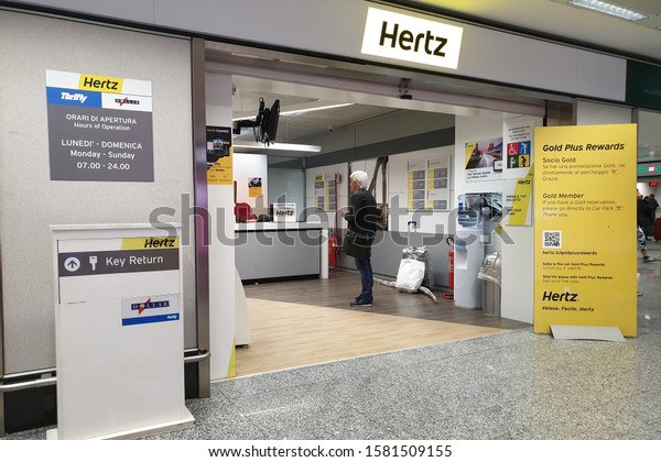 Milan, Italy - 30 OCT 2019: View of Hertz\
rental car office in Milan Malpensa Airport. It it is an American\
car rental company with international locations in 150 countries\
worldwide.