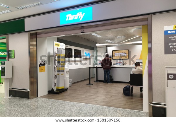 Milan, Italy - 30 OCT 2019: View of Thrifty\
rental car office in Milan Malpensa Airport. It it is an American\
car rental company with international locations in 150 countries\
worldwide.