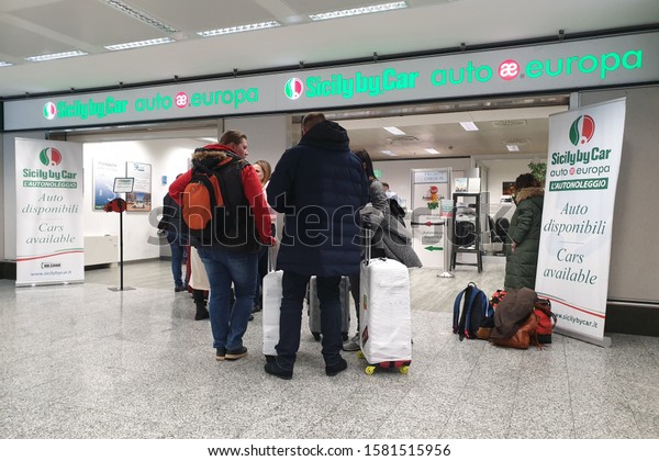 Milan, Italy - 30 OCT\
2019: View of Sicily By Car Auto Europa car rental office in Milan\
Malpensa Airport.
