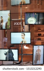 Milan, Italy. About September 2019. Fashion Boutique With Shop Windows On Via Montenapoleone In Milan. Fashion Videos On TV Screens In The Shop Window.
