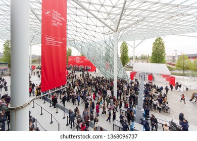 MILAN, ITALY - APR 12, 2019: People at the entrance of Salone del Mobile 2019, the greatest international furniture and accessories exhibition.