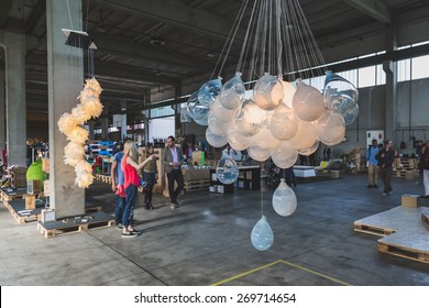 MILAN, ITALY - APRIL 14: People visit Fuorisalone at Ventura Lambrate space, location of important events during Milan Design Week on APRIL 14, 2015 in Milan.