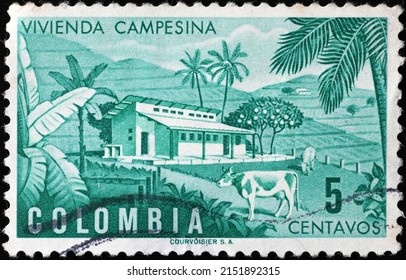 Milan, Italy - April 21, 2022: Farm on vintage postage stamp of Colombia