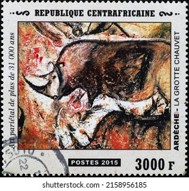 Milan, Italy - April 21, 2022: Prehistoric depictions of a rhino from Chauvet caves on stamp