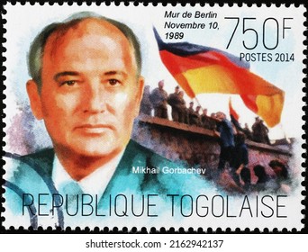 Milan, Italy - April 21, 2022: Mikhail Gorbachev And The Wall Of Berlin On Postage Stamp