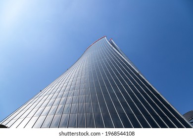 Milan, Italy - April 25, 2021. CityLife Shopping District Glass Buildings In A Hot Spring Day. Three Skyscrapers: The Straight One, The Twisted One, The Curved On After COVID-19 Lockdown