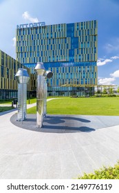 Milan, Italy - April 25, 2022: Street View Of Sunset In Milan Architecture With A Brand New Golden Office Building In Romolo Area. No People Are Visible.