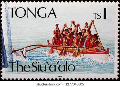 Milan, Italy – December 11, 2018: Outrigger Canoe On Postage Stamp Of Tonga