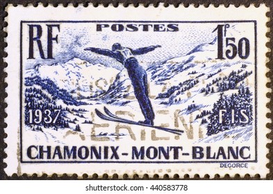 Milan, Italy - December 18, 2013: Vintage Stamp Showing A Ski Jumper In Chamonix, France.