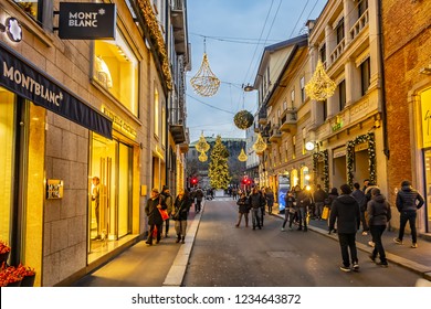 MILAN, ITALY - DECEMBER 31, 2017: Milan streets in the city center at evening. Night illumination on the city street. Lombardy, Northern Italy.