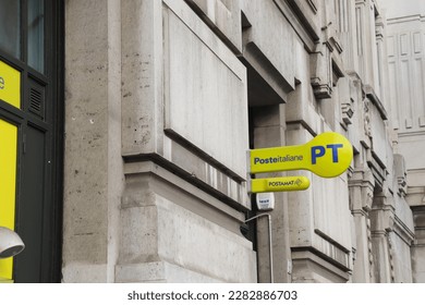 Milan, Italy - December 8, 2022: Poste Italiane is the national postal service provider in Italy with It's Bright Yellow Sign Logo and Blue Lettering - Shutterstock ID 2282886703