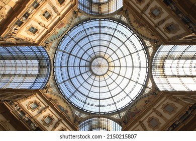Milan, Italy - December 9, 2021: Huge glass-vaulted beautiful cupola of world-famous Galleria Vittorio Emanuele II (il salotto di Milano), the oldest active shopping gallery, major landmark in country