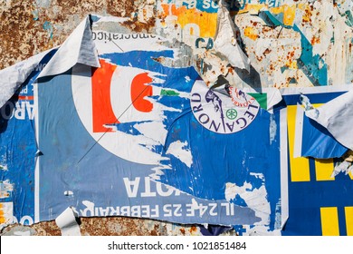 Milan, Italy - Feb 10, 2018: Ripped Up Billboards Ahead Of  2018 Italian General Election Is Due To Be Held On March 4th, 2018