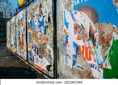 Milan, Italy - Feb 10, 2018: Ripped Up Billboards Ahead Of  2018 Italian General Election Is Due To Be Held On March 4th, 2018