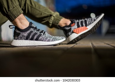 Milan, Italy - February 02, 2018: Man wearing a pair of Adidas NMD_R2 PK in the street