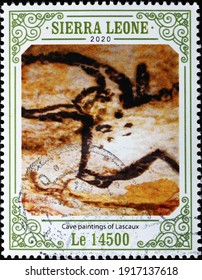 Milan, Italy  - February 02, 2021: Aurochs in cave paintings of Lascaux on postage stamp