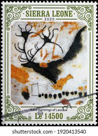 Milan, Italy  - February 04, 2021: Stag in cave paintings of Lascaux on postage stamp