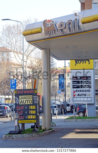 Milan,\
Italy february 19,2019 - Eni petrol station for refueling cars,\
rising costs of green petrol gasoline - gas station in the city\
center in the vicinity of housing , logo and\
sign