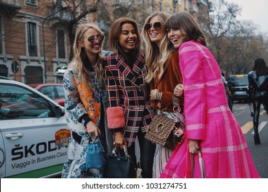 Milan, Italy - February 22, 2018: Fashionable girl walking after Fendi show during Milan Fashion Week - street style concept.