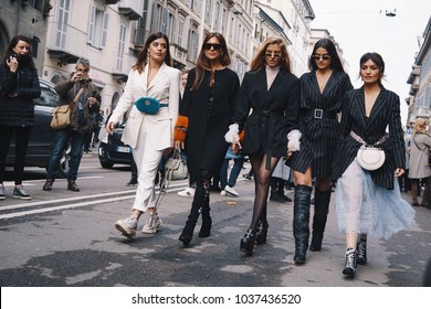 Milan, Italy - February 24, 2018: Fashionable models, bloggers and influencers posing and walking on the street after Ermanno Scervino show during Milan Fashion Show.