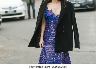 Milan, Italy - February 24, 2022: Street Style, Woman Wearing A Navy Blue Large Sequins And V-neck Long Dress, A Black Blazer Jacket, Black Shiny Varnished Leather Platform Heels Pumps Heels Shoes.