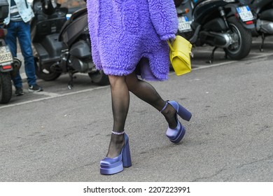 Milan, Italy - February, 24, 2022: Street Style, Woman Wearing A Furry Purple Coat, Yellow Bag And Purple Sandals..