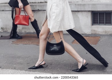 Milan, Italy - February, 24: Street Style, Woman Wearing Cream Leather Jacket, Mini Skirt With Long Train, Black Prada Bag And Prada Heels.