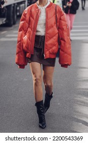 Milan, Italy - February, 24: Street Style, Woman Wearing Red Shiny Leather Crocodile Print Puffer Jacket And Black Shiny Leather Heels Ankle Boots.