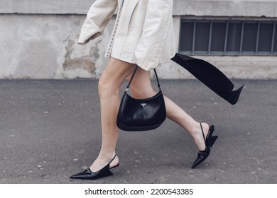 Milan, Italy - February, 24: Street Style, Woman Wearing Cream Leather Jacket, Mini Skirt With Long Train, Black Prada Bag And Prada Heels.