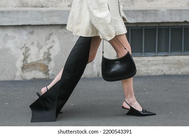 Milan, Italy - February, 24: Street Style, Woman Wearing Cream Leather Jacket, Mini Skirt With Long Train, Black Prada Bag And Prada Heels.