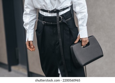 Milan, Italy - February, 24: Street Style, Woman Wearing White V-neck Shirt And Black Leather Pants.