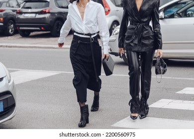 Milan, Italy - February, 24: Street Style, Woman Wearing White V-neck Shirt And Black Leather Pants.