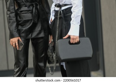 Milan, Italy - February, 24: Street Style, Woman Wearing White V-neck Shirt And Black Leather Pants.